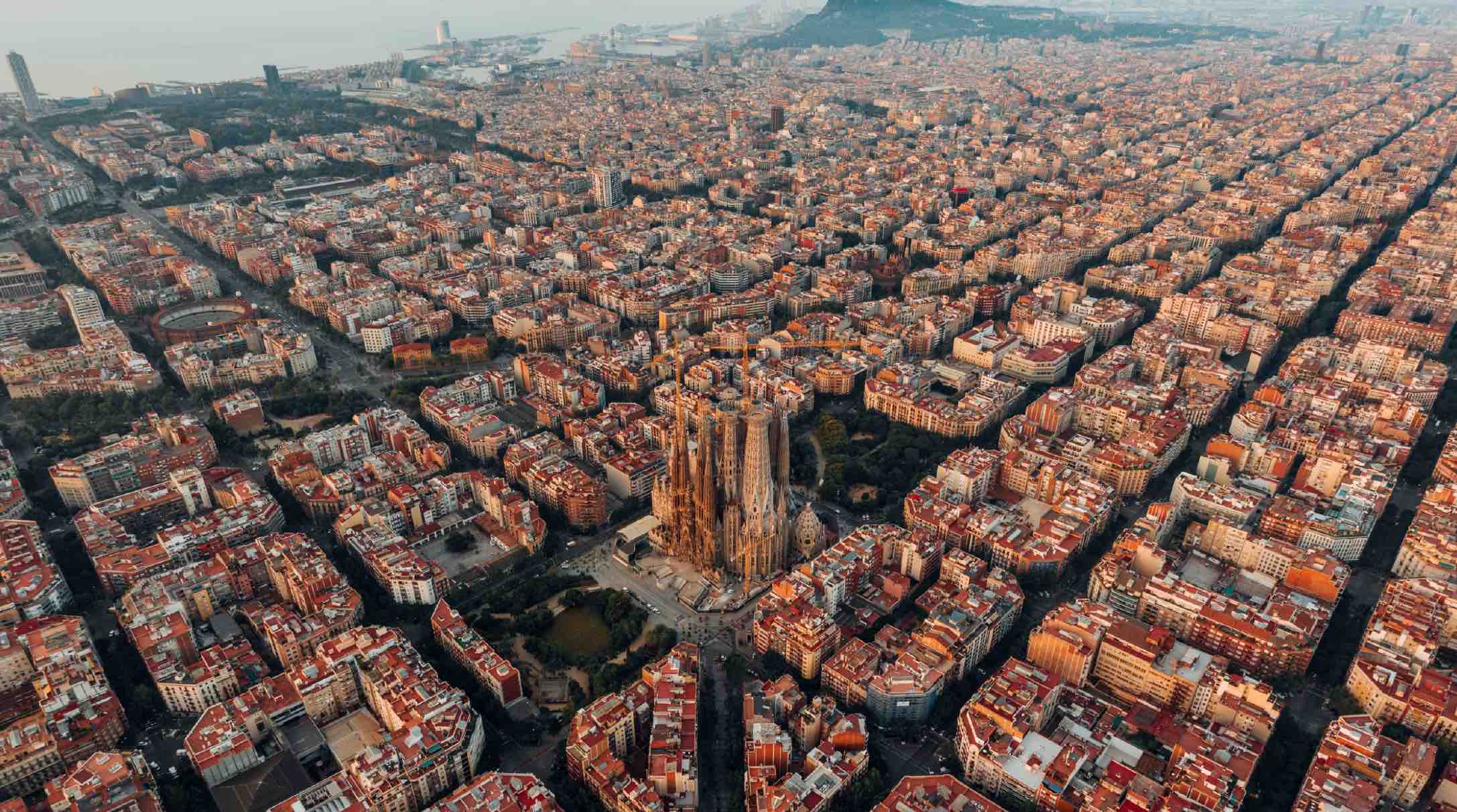 
Image of Barcelona city blocks from above

Why is Barcelona build in squares?
